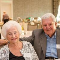 Two guests sitting at a table at Naples 2019